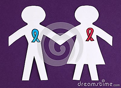 Paper's couple with blue and pink cancer awareness ribbons Stock Photo