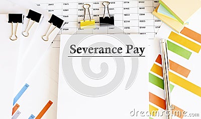 Paper with Severance Pay on a table with chart Stock Photo