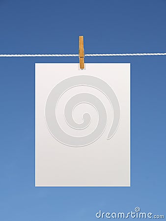 Paper sheet on a clothes line Stock Photo