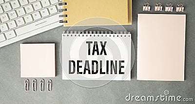 Paper sheet with text TAX DEADLINE, calculator Stock Photo