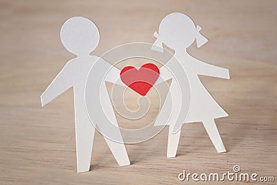 Paper silhouette of children with a heart - childhood love conc Stock Photo