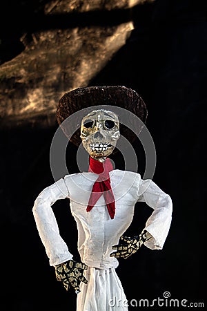 Paper skull or catrina of man dressed as a Mexican cowboyA Stock Photo