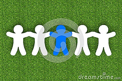 Paper team white people over grass background Stock Photo