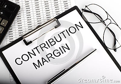 Paper with text Contribution Margin on table on chart Stock Photo
