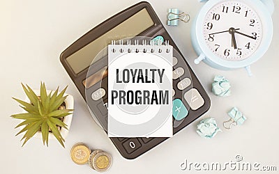 Paper with text Loyalty Program on the table Stock Photo