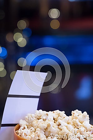 Tickets and popcorn for going to the movies Stock Photo
