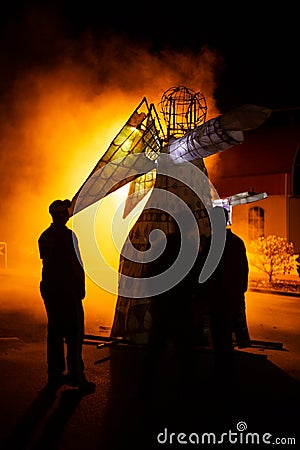 Paper and timber framed angel figure catches on fire Editorial Stock Photo