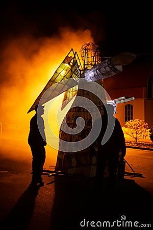 Paper and timber framed angel figure catches on fire Editorial Stock Photo