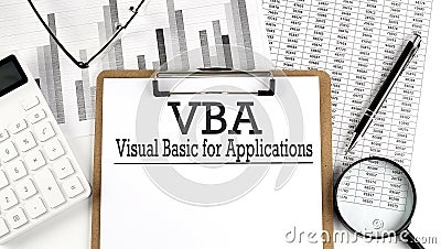 Paper with Visual Basic for Applications VBA on a chart with calculator,pen and magnifier Stock Photo