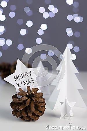 Paper work Christmas and new year star card on pine cones decora Stock Photo