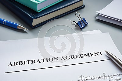 Papers with arbitration agreement and a pen. Stock Photo
