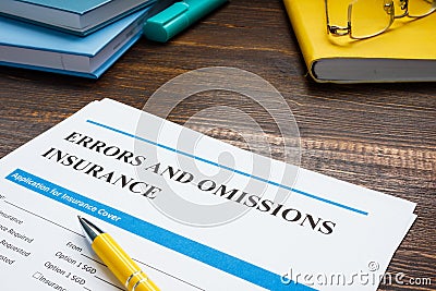 Papers with errors and omissions insurance eo form. Stock Photo