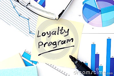 Papers with graphs and Loyalty Program concept. Stock Photo