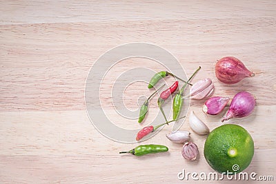 Paprika, garlic, shallot and lemon on cutting board Stock Photo