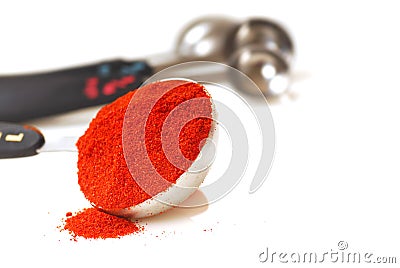 Paprika in a measuring spoon Stock Photo