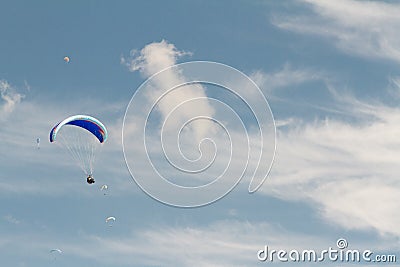 A para-glider up in the sky during a fly, surrounded by the clouds Stock Photo