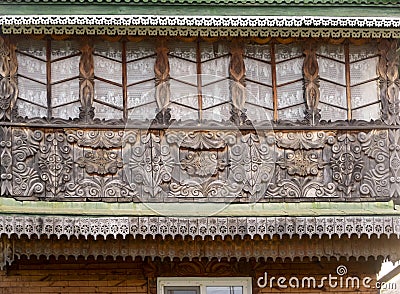 PARABEL, RUSSIA - AUGUST 1, 2023: A fragment of a wooden house decorated with carvings Editorial Stock Photo