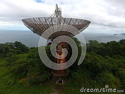 Parabolic satellite antenna dish for wireless radio signal data transfer. Abandoned equipment. Stock Photo