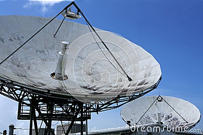 Parabolic satellite dish receiver over blue sky Stock Photo