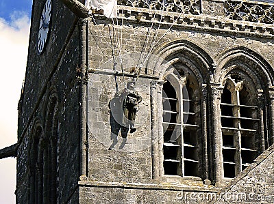 Parachutist in bell tower, Normandy Stock Photo