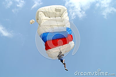 Parachutist with white blue red parachute on parachuting competition Editorial Stock Photo