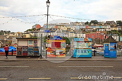 A parade of colourful fishing kiosks in Brixham, South Devon Editorial Stock Photo