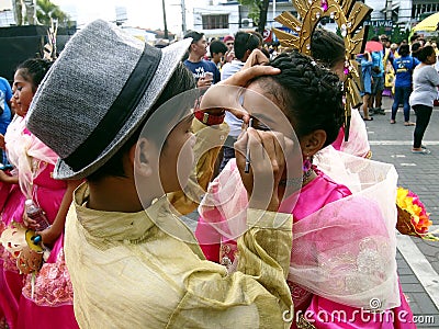 Parade participants apply make up to each other during the Sumaka Festival in Antipolo City. Editorial Stock Photo