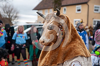 Parade participants in cow costumes and masks Editorial Stock Photo