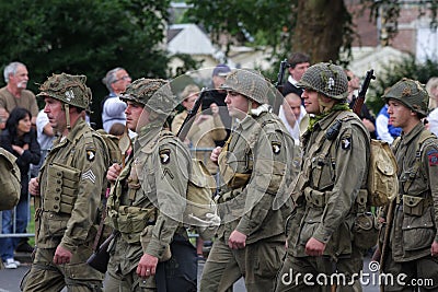 Parade of people disguised as US soldiers of the Second World War , France Editorial Stock Photo