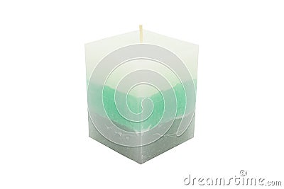 A paraffin small, square, candle in sea color lies on a white background with a clipping path. Stock Photo