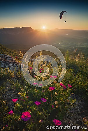 Paraglide silhouette flying over the Crimea mountains Stock Photo