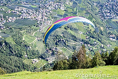 Paraglider above Dorf Tirol, vacation resort with apple orchads, Tirol Castle, hiking trails, , Alto Adige, South Tyrol, Italy Stock Photo