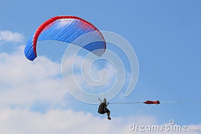 Paraglider being towed on a winch launch Stock Photo