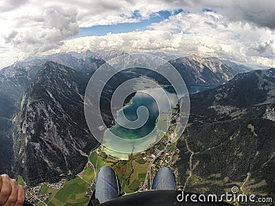 Paraglider flying over mountains Stock Photo