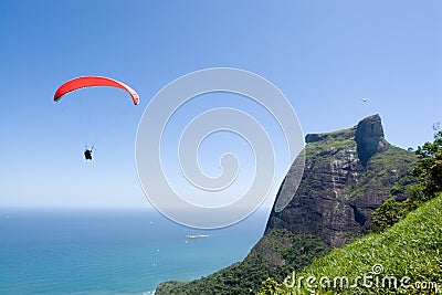 Paraglider and Rock Mountain Stock Photo