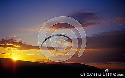 Paraglider at sunset. Stock Photo