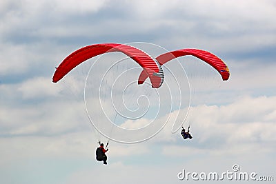 Paragliders flying red wings Editorial Stock Photo