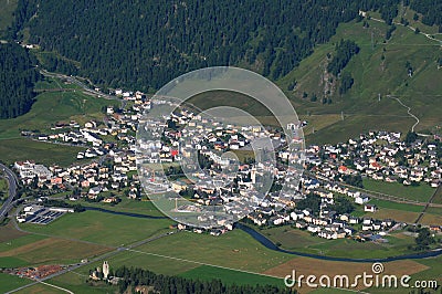 Paragliding above swiss moutnain village Celerina in the Upper E Stock Photo