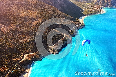 Paragliding flight over the sea coast of the Mediterranean Sea. Blue parachute against the blue sea. Turkey. Oludeniz. Aerial phot Stock Photo