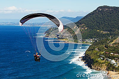 Paragliding over the acean and coastal escarpment Stock Photo
