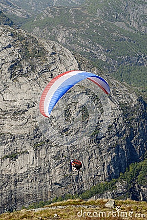 Paragliding over mountains Stock Photo