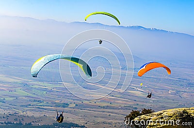 Paragliding over the tops of the mountains Editorial Stock Photo