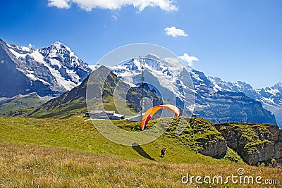 Paragliding in swiss alps Stock Photo