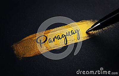 Paraguay Handwriting Text on Golden Paint Brush Stroke Stock Photo