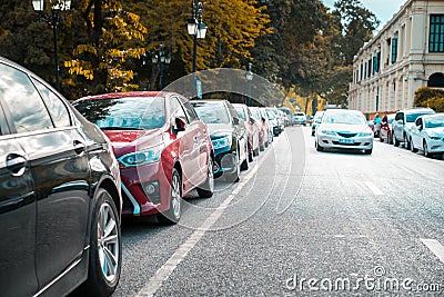 Parallel parking cars on urban street. Outdoor parking on road Editorial Stock Photo