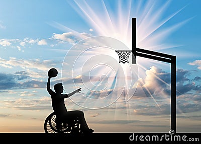 Paralympic disabled person in wheelchair playing basketball in afternoon Stock Photo