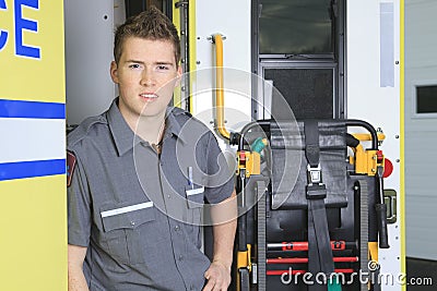 Paramedic employee with ambulance Stock Photo