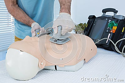 Paramedic practicing resuscitation on dummy Stock Photo