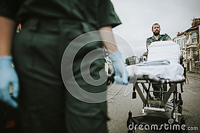 Paramedic team rolling a stretcher on a street Stock Photo