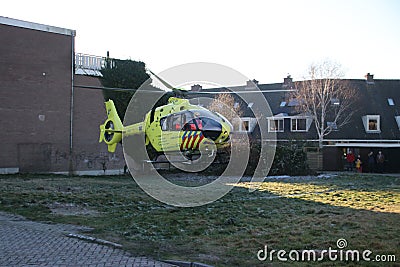 Paramedic trauma helicopter PH-ELP or Lifeliner 2 leaving scene of incident in Waddinxveen the Netherlands. Editorial Stock Photo